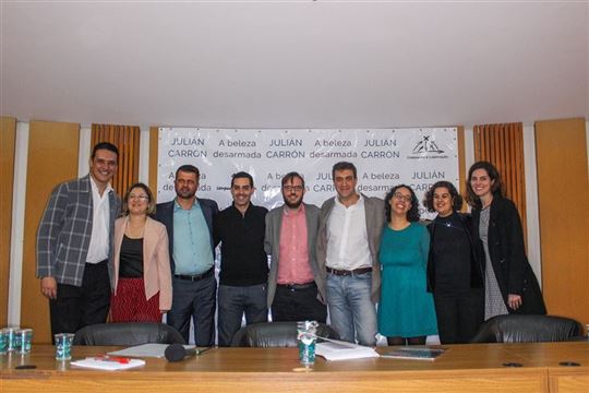 Os palestrantes e os organizadores do evento